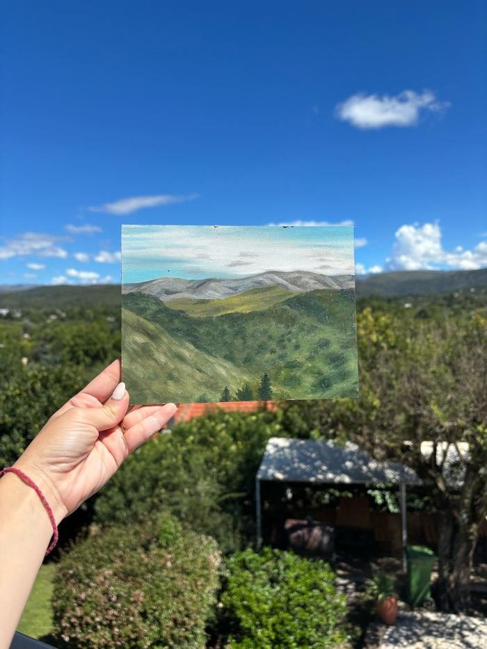 Óleo sobre madera de las sierras de Córdoba, sostenido frente a las sierras